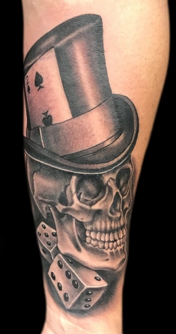 skull and top hat and dice tattoo
