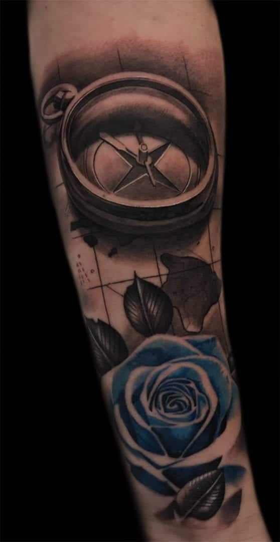 compass rose and flower tattoo
