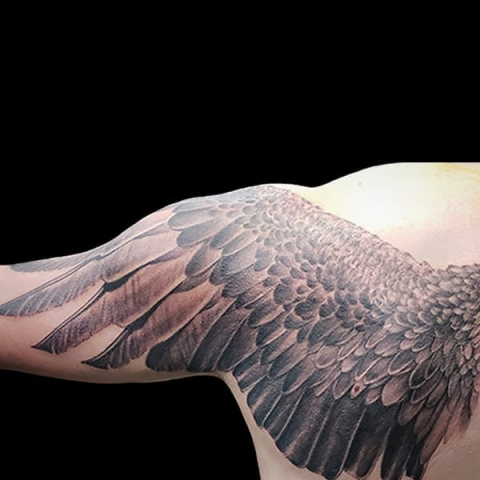 photorealistic wing back tattoo