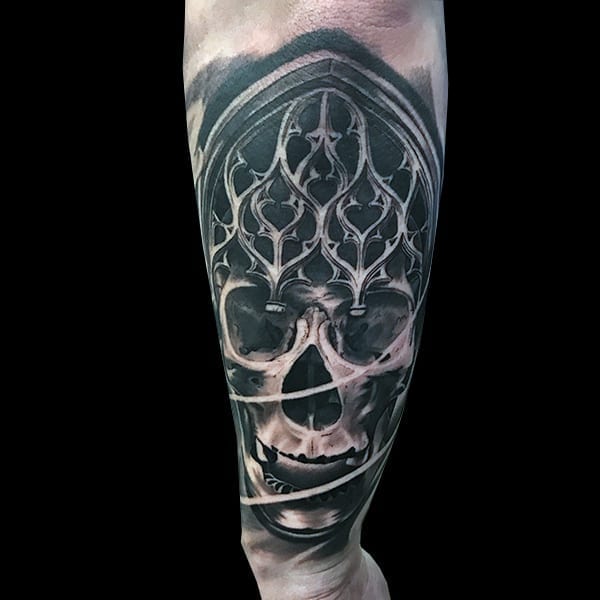 skull and statue tattoo