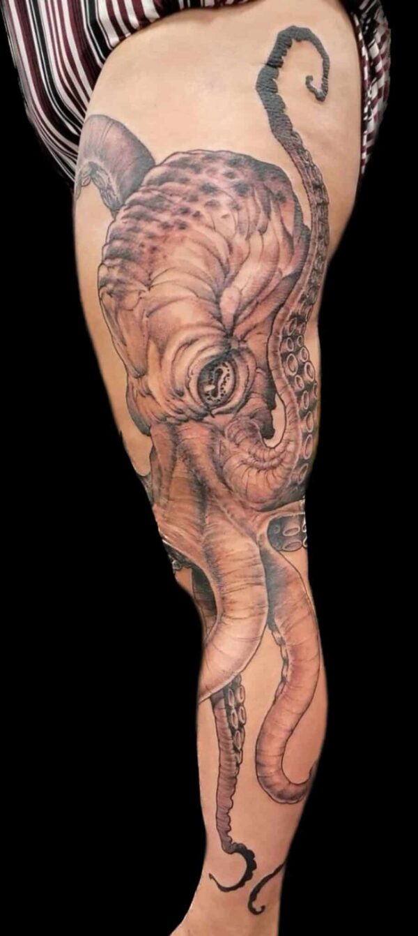 Realistic black and Grey octopus thigh tattoo