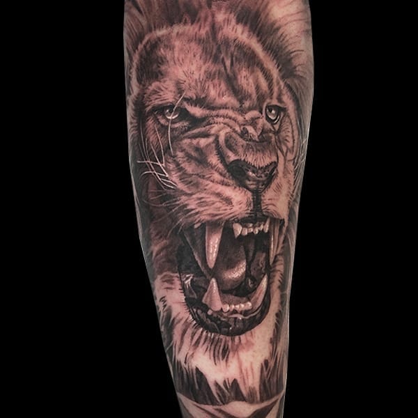photorealistic lion tattoo