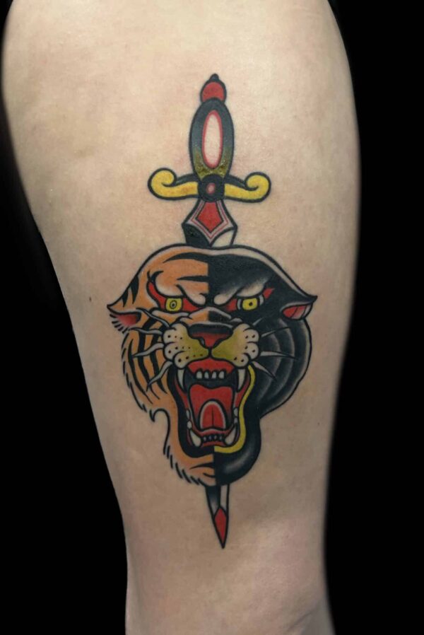 Traditional dagger panther tiger tattoo