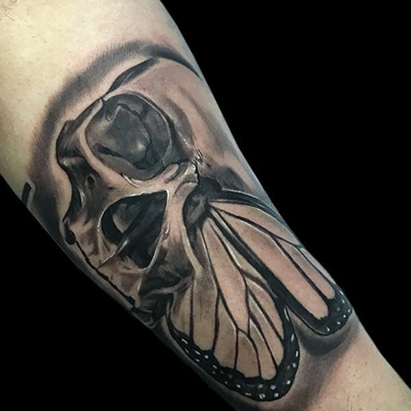 skull and butterfly realistic tattoo