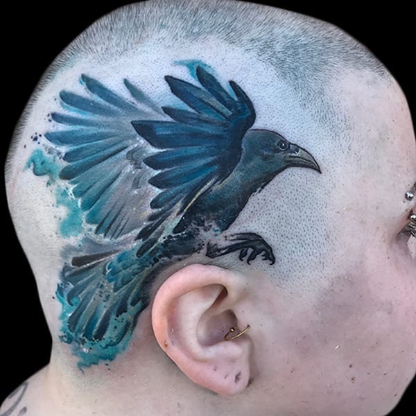 raven on side of head tattoo