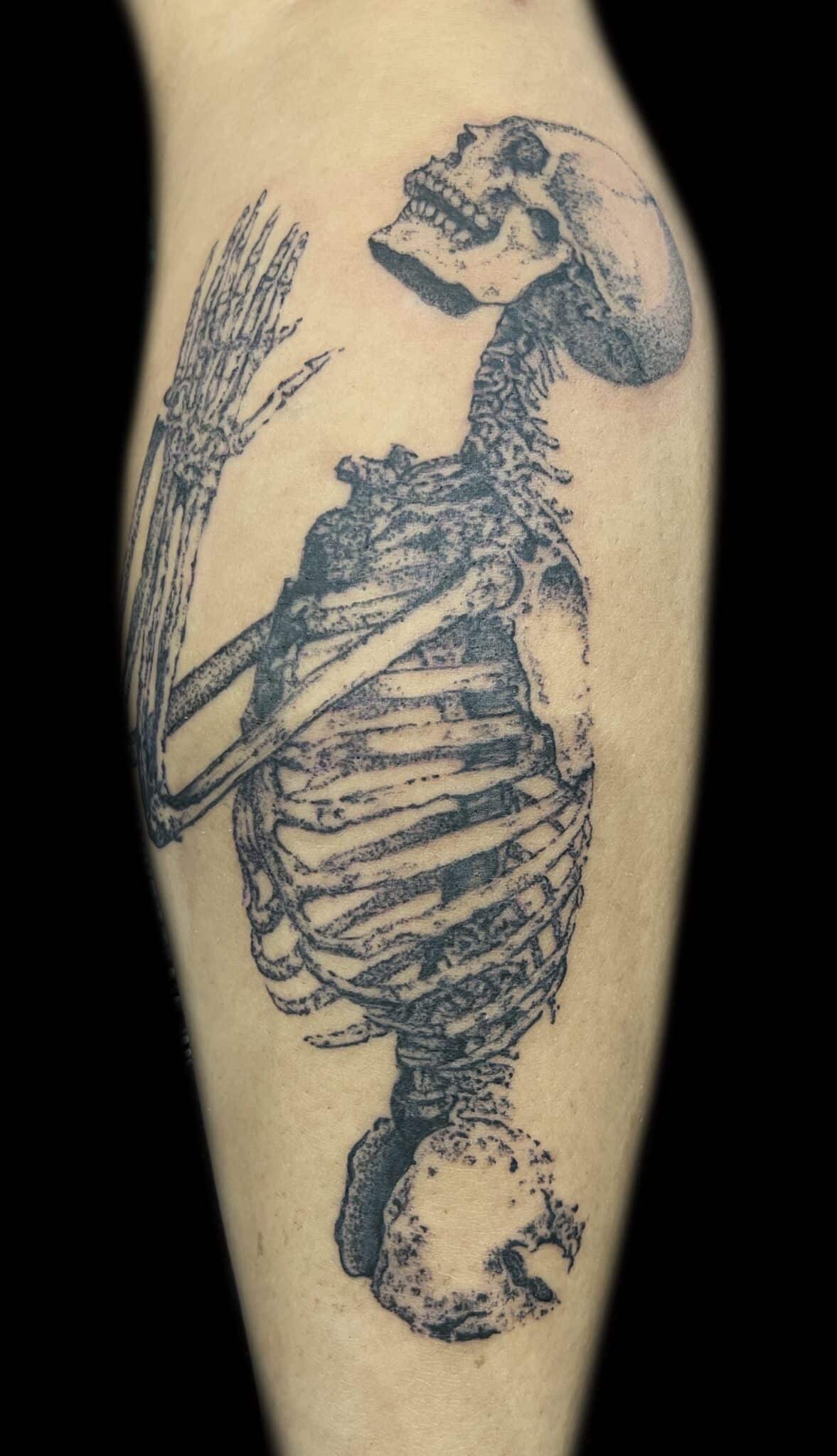 black and grey skeleton tattoo
