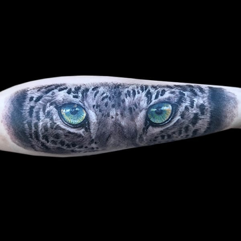 leopard on forearm tattoo