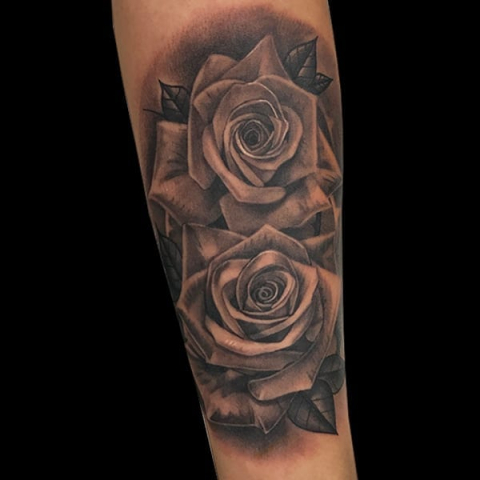 black and grey photorealistic flower tattoo