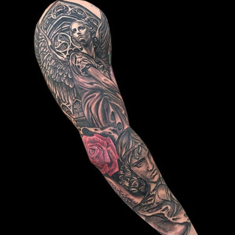 black and grey flower and statue tattoo sleeve