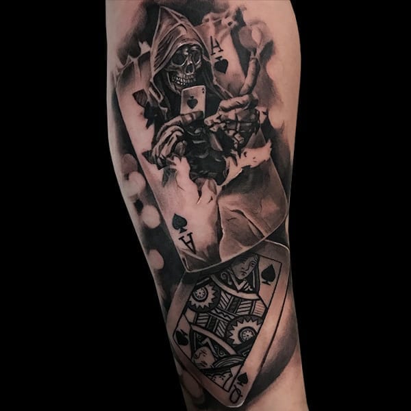 skull and playing card tattoo