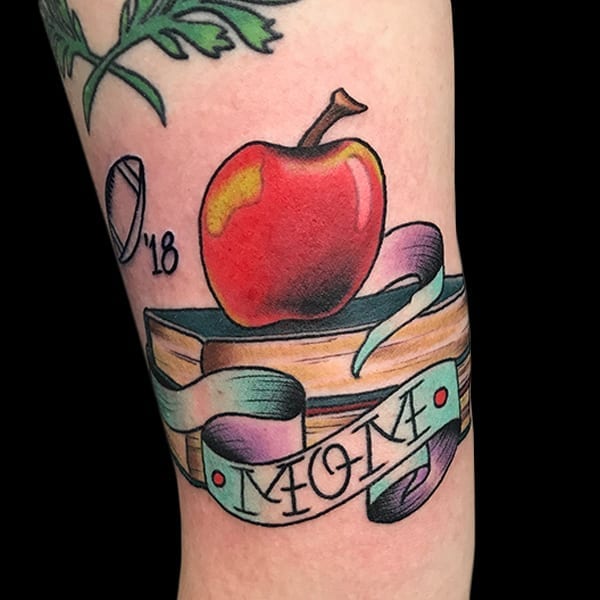 book and apple tattoo