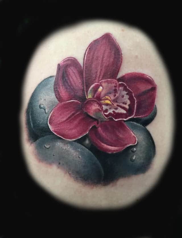 orchid and pebble tattoo
