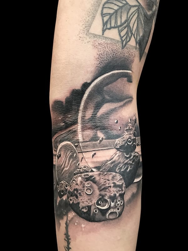 realistic space tattoo, Elijah Nguyen, Artist at Revolt Tattoos