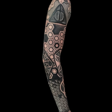 geometric sleeve tattoo, Elijah Nguyen, Artist at Revolt Tattoos