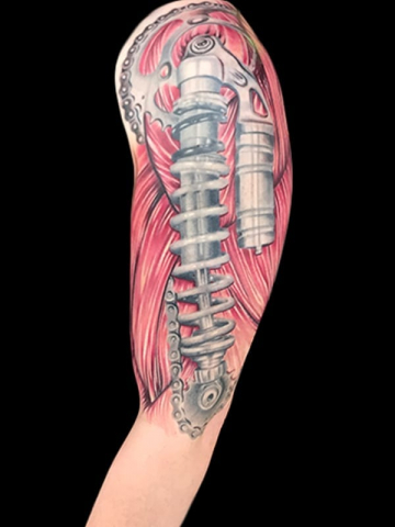 shock and muscle tattoo, Elijah Nguyen, Artist at Revolt Tattoos