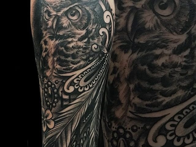 owl and feather tattoo