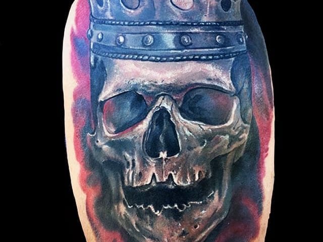 realistic skull with crown tattoo