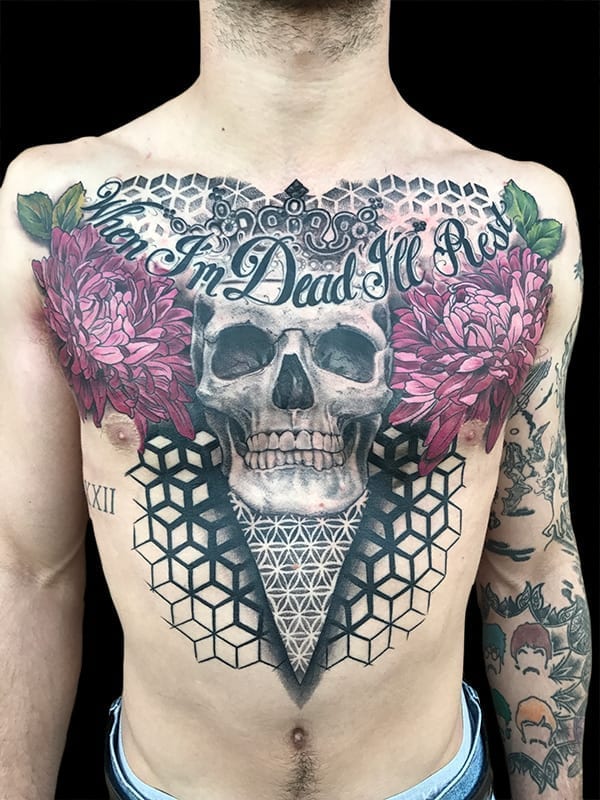 skull and geometric chest piece tattoo