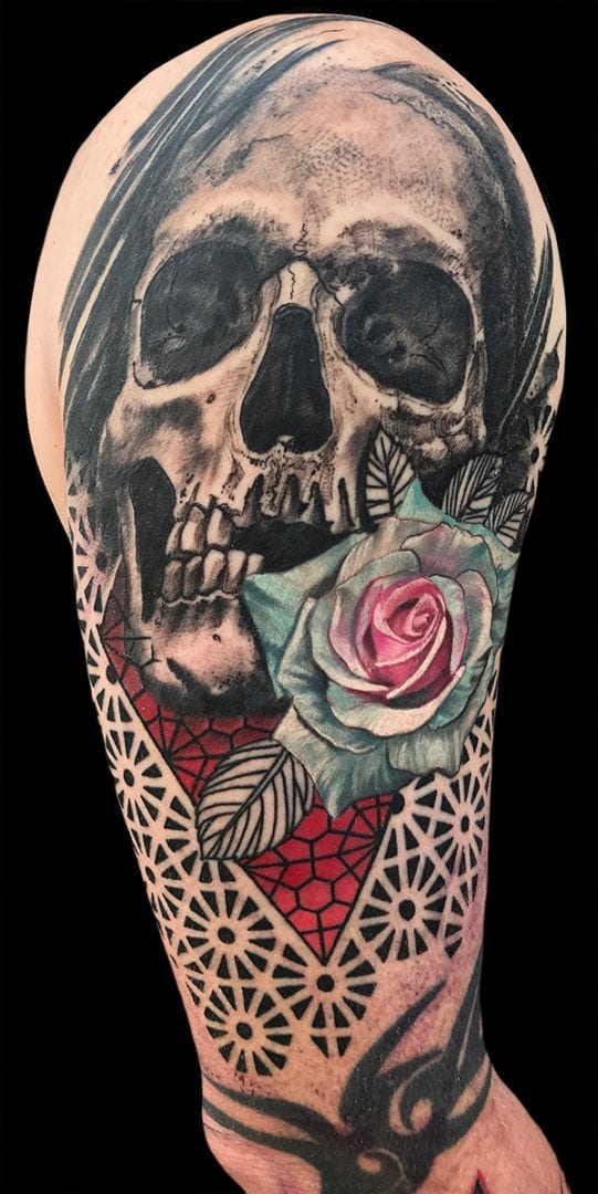 realistic skull geometric tattoo