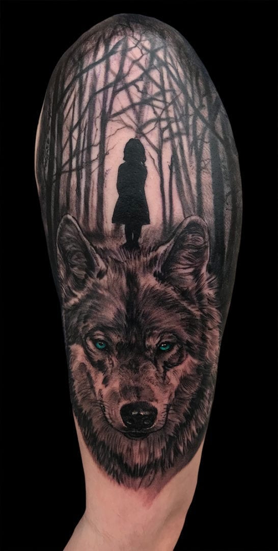 wolf and nature scene tattoo