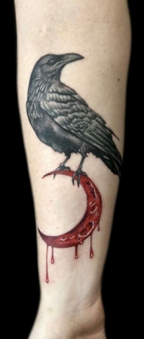 Realistic raven and crescent moon tattoo