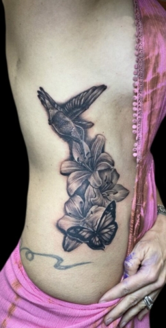 hummingbird lily flower ribcage tattoo