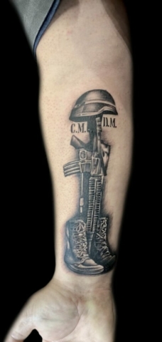 Soldier's cross tattoo
