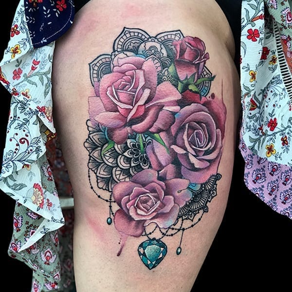 Color realism floral tattoo thigh piece