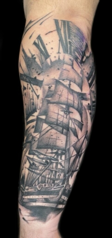 black and grey ship tattoo