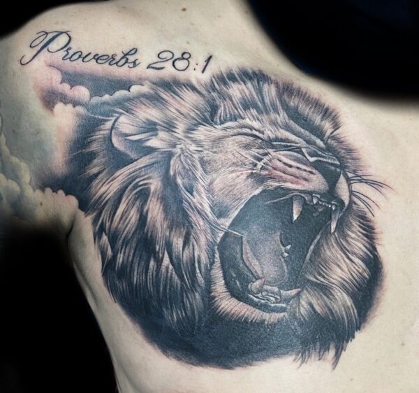 Realistic lion tattoo