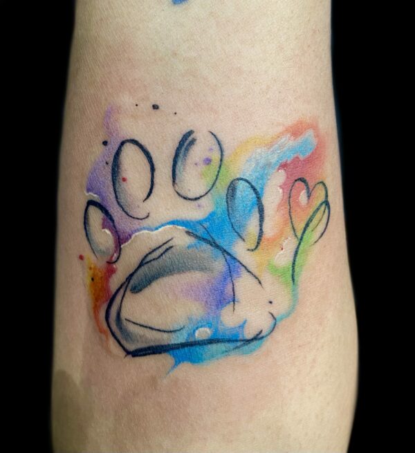 Watercolor paw print tattoo