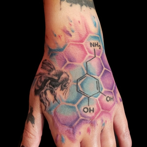 bee and hexagon hand tattoo