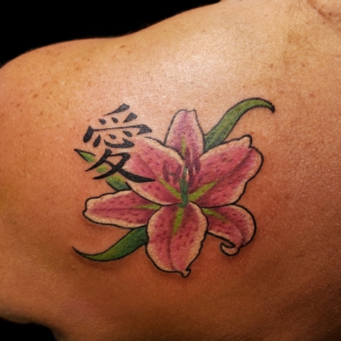 lily flower color realism back tattoo