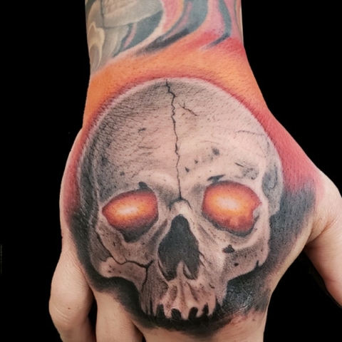 Skull realism hand tattoo