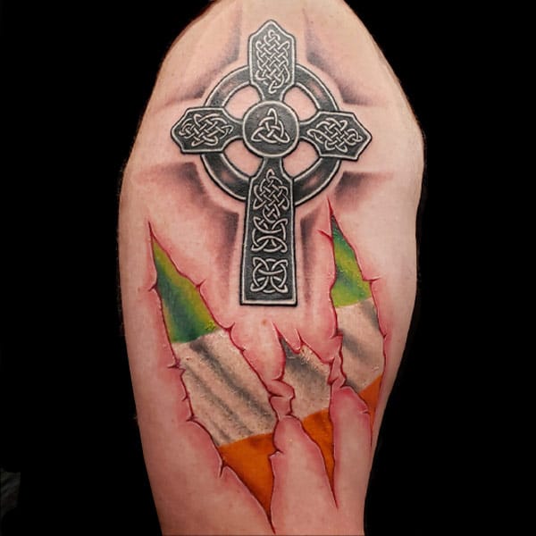skin rip irish tattoo celtic cross