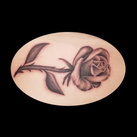 photorealistic black flower tattoo