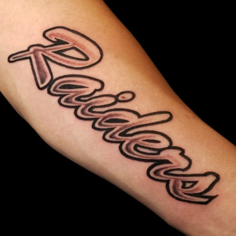 raiders lettering tattoo