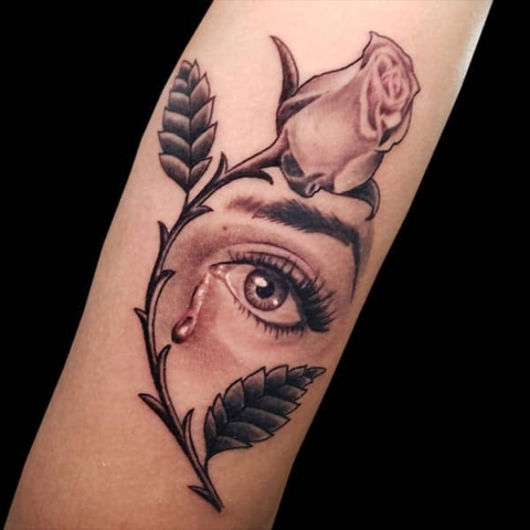 realistic rose and eye tattoo