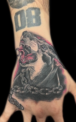dog hand tattoo