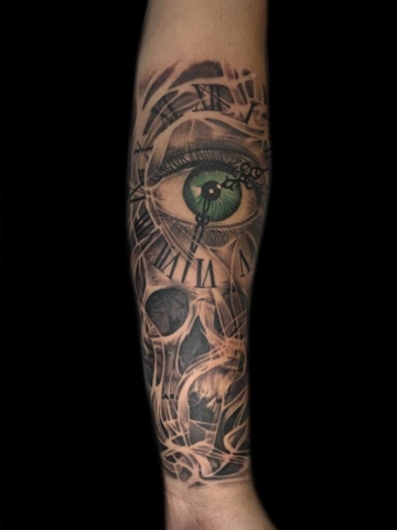 realistic eye and skull tattoo