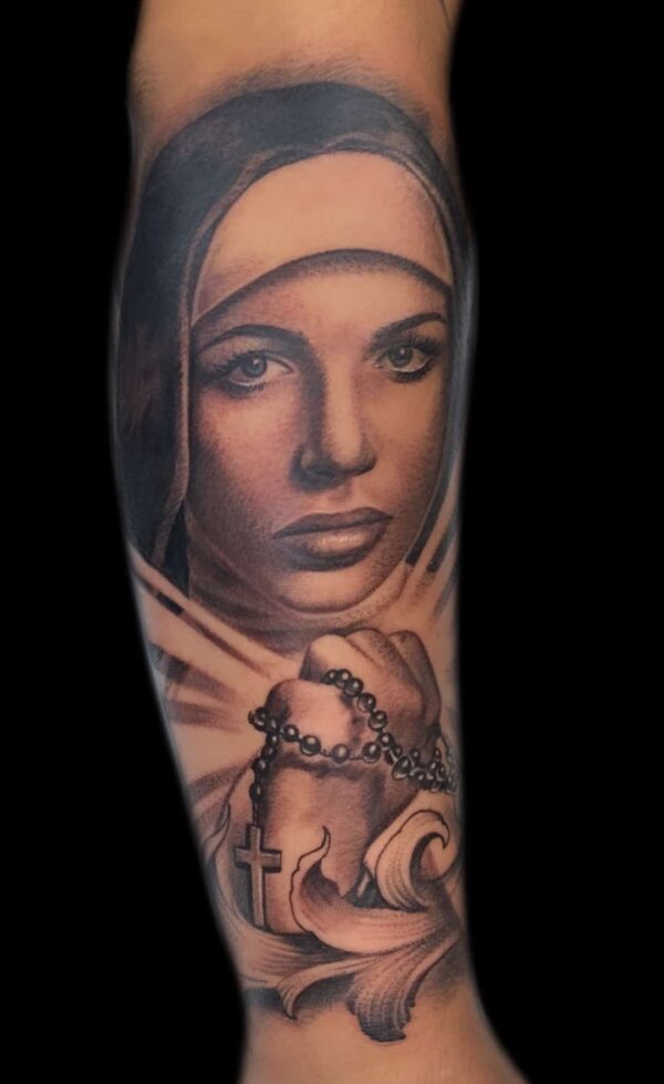 realistic nun and rosary tattoo