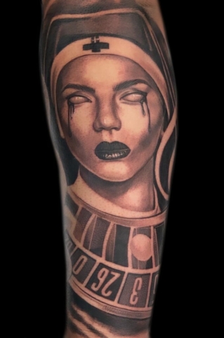 nun and roulette wheel tattoo