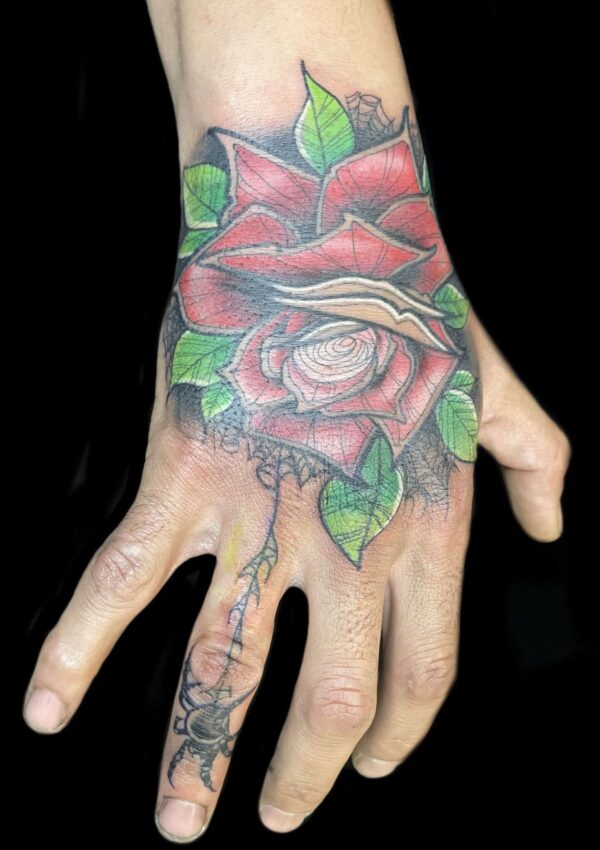 Hand rose tattoo
