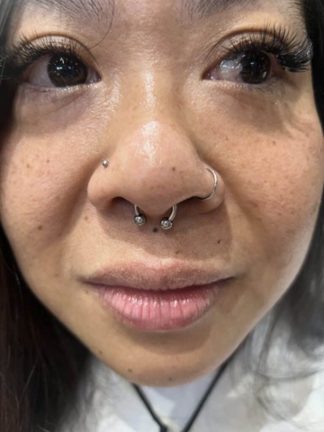 septum and nostril piercing