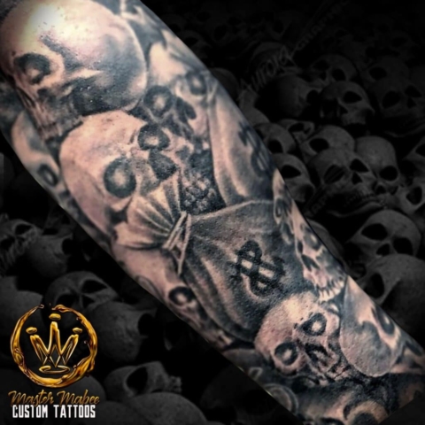 skull and money bag tattoo