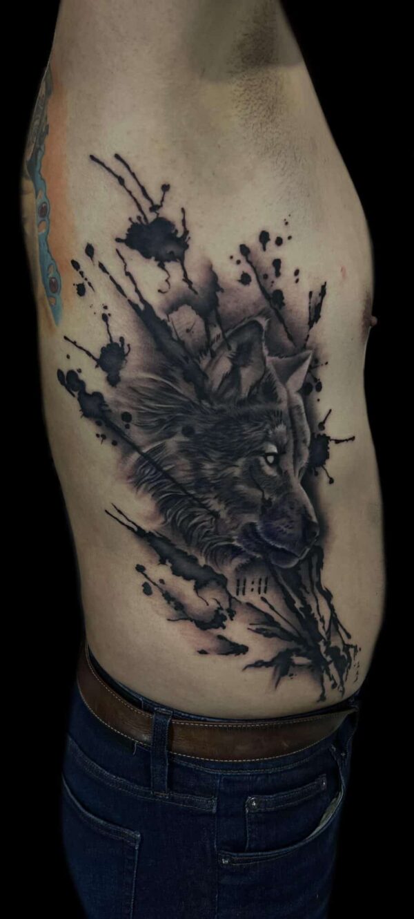 wolf black and grey rib tattoo, Danny DaVinci, Artist, Revolt Tattoos