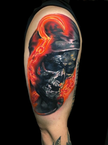 glowing chain skull tattoo design, Tattoo by Chris Beck, artist at Revolt Tattoos
