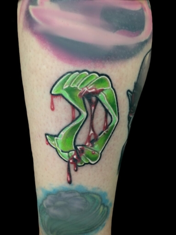 plastic teeth horror tattoo, Tattoo by Chris Beck, artist at Revolt Tattoos