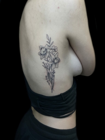 floral rib piece tattoo