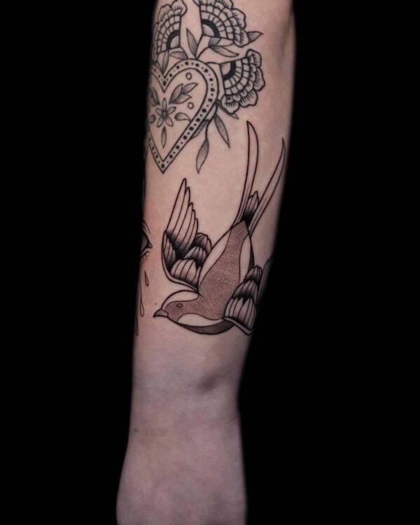 traditional sparrow wrist tattoo, Demi DiMartino, artist at Revolt Tattoos